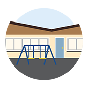 School with a swing set in front